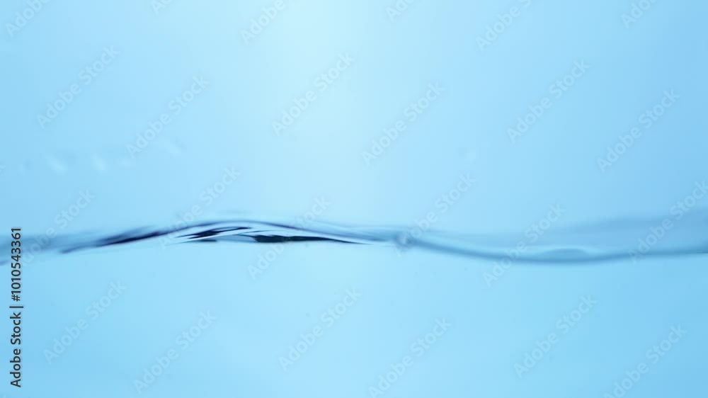 Crystal-clear water swirls smoothly, reflecting light as bubbles rise, representing freshness, fluidity, and calm in a natural scene. Crystal-clear water swirls smoothly, reflecting light as bubbles rise, representing freshness, fluidity, and calm in a natural scene.