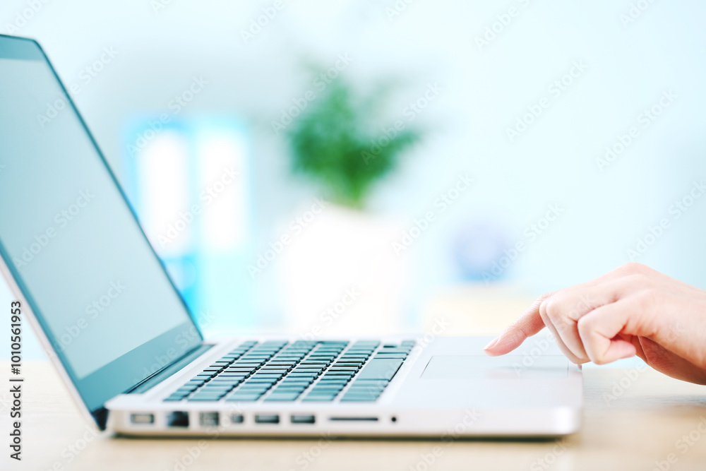 Office worker working on a laptop Office worker working on a laptop