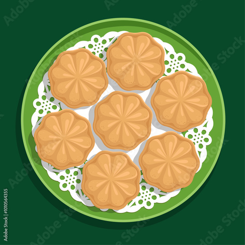 Hari Raya Kuih Bahulu on green plate top view