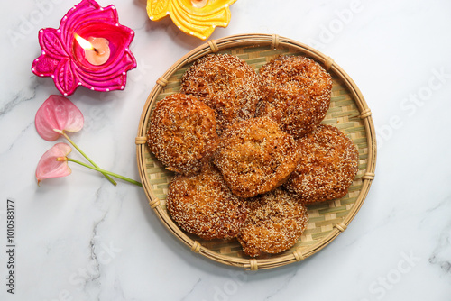 Anarsa is a popular Indian sweet made from rice, sugar, ghee, and poppy seeds. Traditionally part of Diwali Faral, Anarase is a crisp, rice based pastry enjoyed during the festive season. copy space. photo