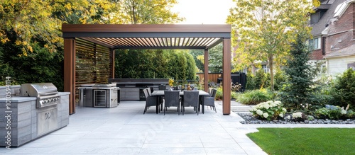 Entertaining is easy on a sleek patio with a pergola, dining set, and grill. photo