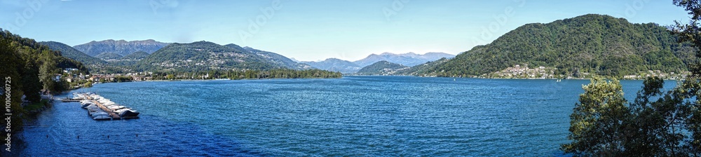 Panoramic image of the Lugano Lake jetty near Caslano. Panoramic image of the Lugano Lake jetty near Caslano.