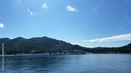 Wallpaper Mural A stunning ferry ride capturing serene ocean views and distant islands on a clear day in Thailand. Perfect for travel projects and coastal scenic shots. Torontodigital.ca