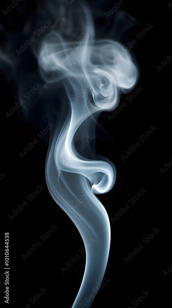 A wisp of smoke against a black background A wisp of smoke against a black background