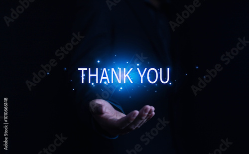 Cuadro en lienzo Businessman using laptop and showing thank you message on display