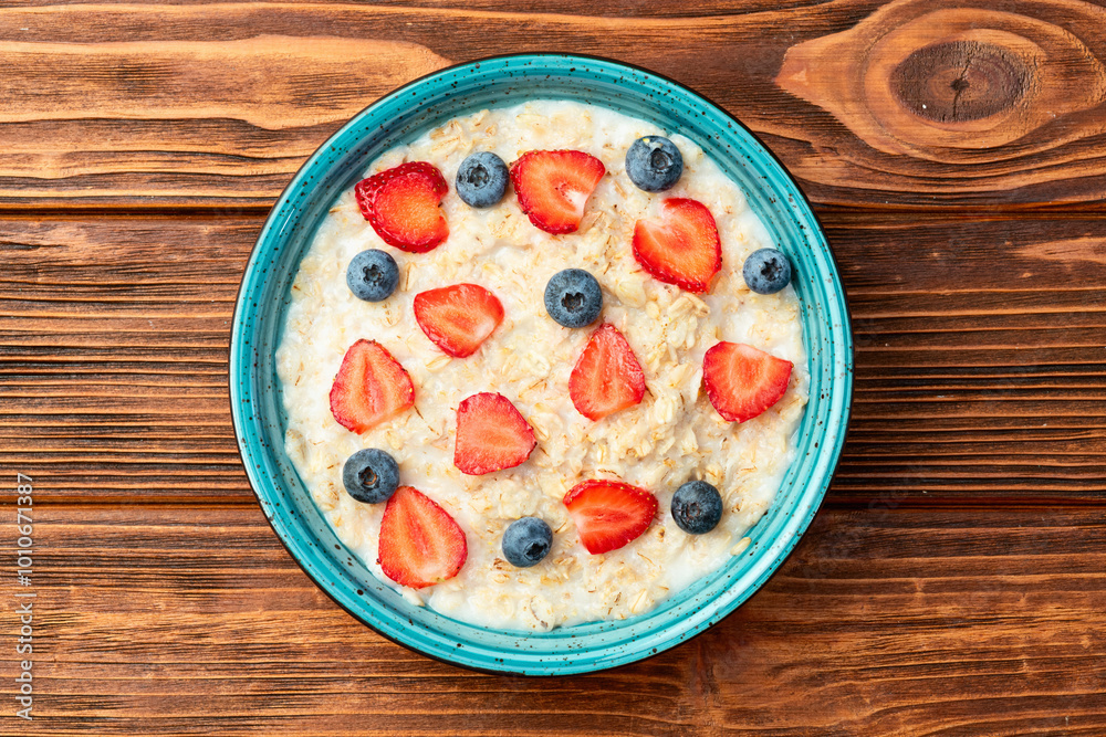 Εκτύπωση καμβά Homemade breakfast . Oatmeal with milk and berries . Top view