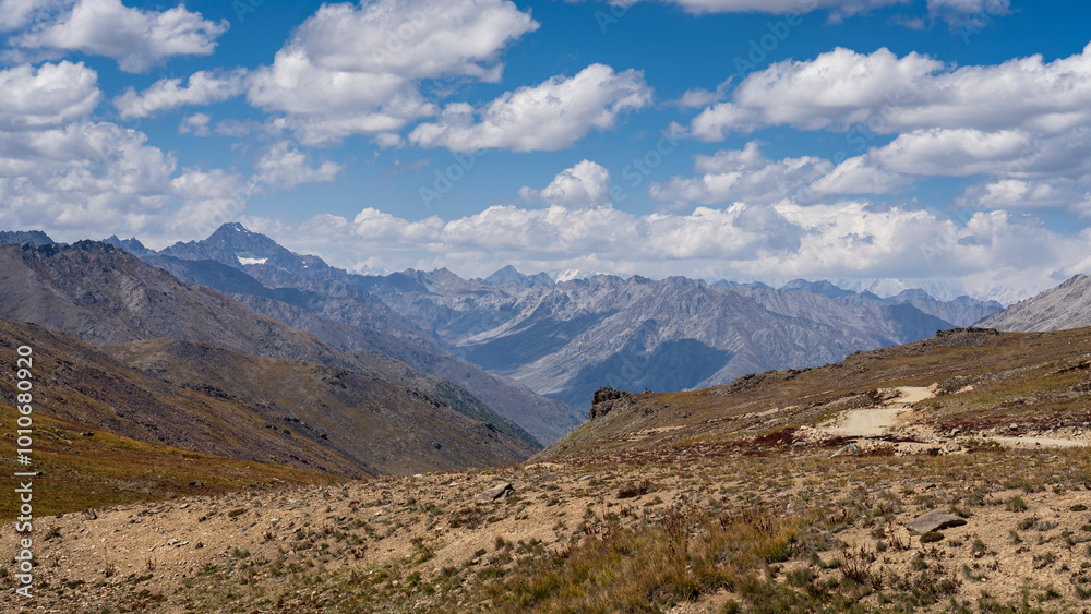 Scenic summer landscape view of high-altitude Deosai Plains with Nanga Parbat in clouds, Astore, Gilgit-Baltistan, Pakistan Scenic summer landscape view of high-altitude Deosai Plains with Nanga Parbat in clouds, Astore, Gilgit-Baltistan, Pakistan