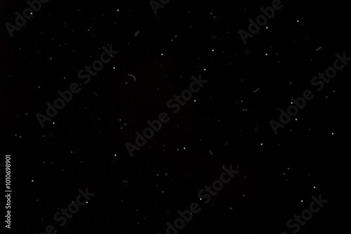 Fototapeta Naklejka Na Ścianę i Meble -  Dust Stock Image In Black Background