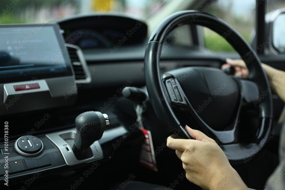 Close up shot of male hands on steering wheel. Travel and transportation concept Close up shot of male hands on steering wheel. Travel and transportation concept