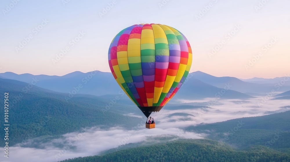 Colorful hot air balloon over misty mountain valley, early morning light, scenic flight, calm and peaceful adventure Colorful hot air balloon over misty mountain valley, early morning light, scenic flight, calm and peaceful adventure
