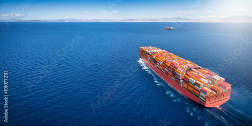 Obraz na płótnie Aerial view of a super cargo container carrier ship traveling over the ocean as a concept banner for transport and industry w salonie