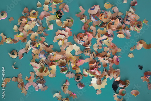 Colorful Pencil Shavings on Blue Background: Creative Educational Style