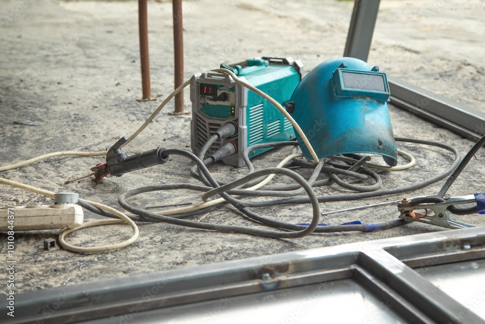 A welding machine with a protective mask. Industry and production A welding machine with a protective mask. Industry and production