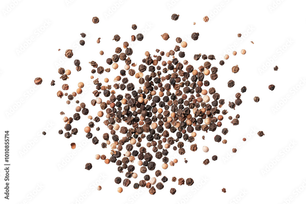 A bunch of black and red pepper flakes are scattered on a white background