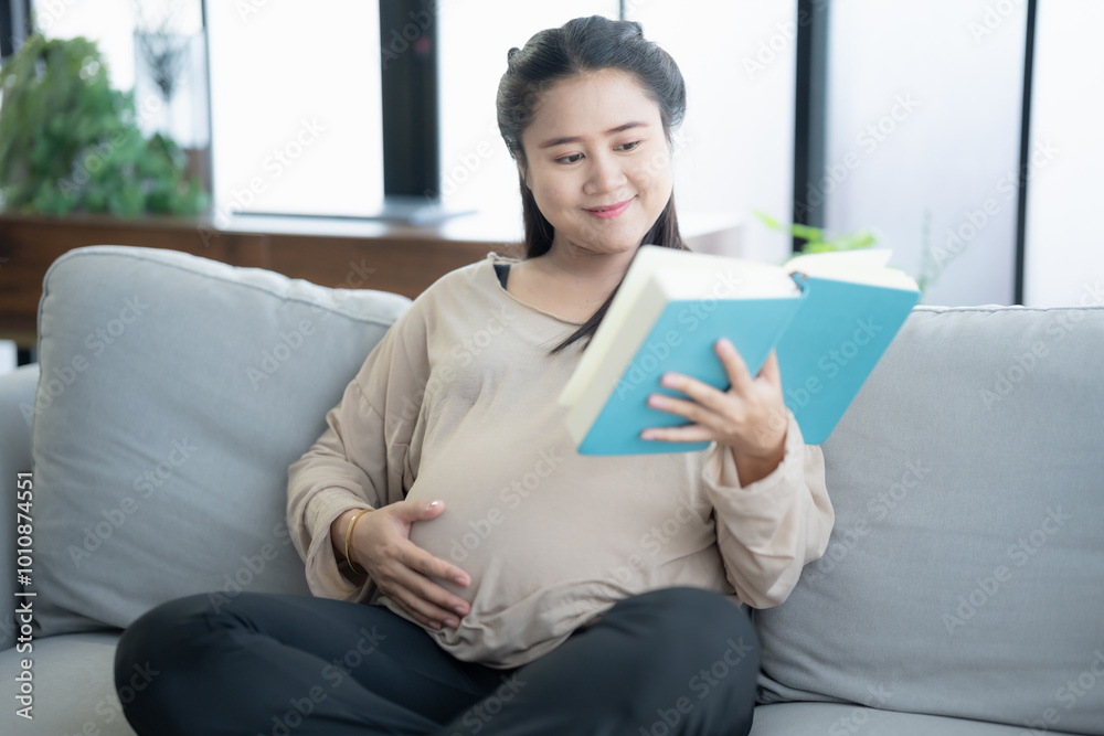 Pregnant asian woman reading book relaxation and Self-care during Pregnancy mother mindfulness Positive life moment in pregnancy time motherhood concept Pregnant asian woman reading book relaxation and Self-care during Pregnancy mother mindfulness Positive life moment in pregnancy time motherhood concept