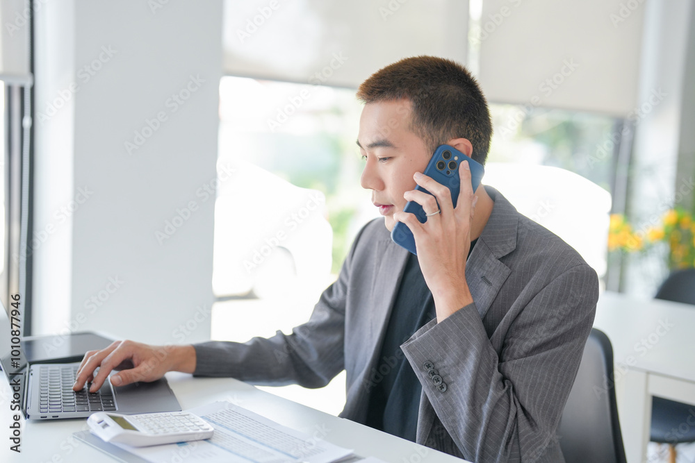 Young Business man holding Smartphone working mobile devices. cell telephone technology e-commerce smartphone for business work Young Business man holding Smartphone working mobile devices. cell telephone technology e-commerce smartphone for business work