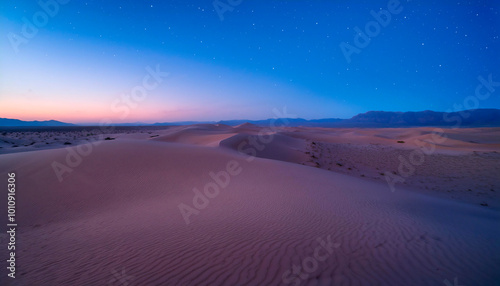 Beautiful desert landscape background with sand dunes and vibrant twilight hues during the blue hour