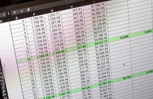 Shot of an dark mode excel sheet on computer screen showing bank loan amortization table. Banking
