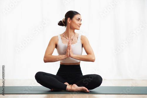 Professional brunette young female practice yoga indoor