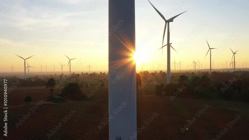 Wind turbines generate electricity at sunrise in the morning. Wind turbines generate electricity at sunrise in the morning.