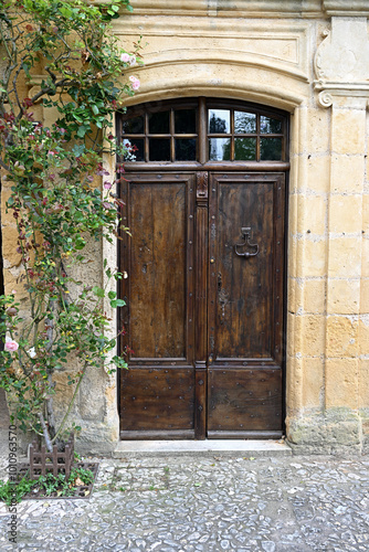 Old wooden door to a house in a medieval french town