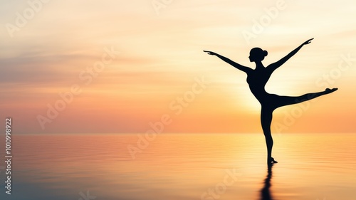 A graceful dancer silhouetted against a colorful sunset over the serene water, embodying beauty and freedom in movement.