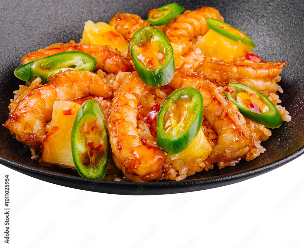 Spicy shrimps and pineapple with rice and chili pepper on black plate Spicy shrimps and pineapple with rice and chili pepper on black plate