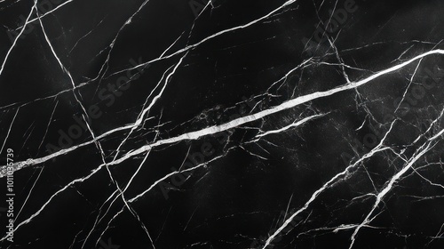 Black marble texture with white veins.