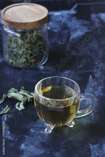 a jar, a cup of lemon balm tea, 