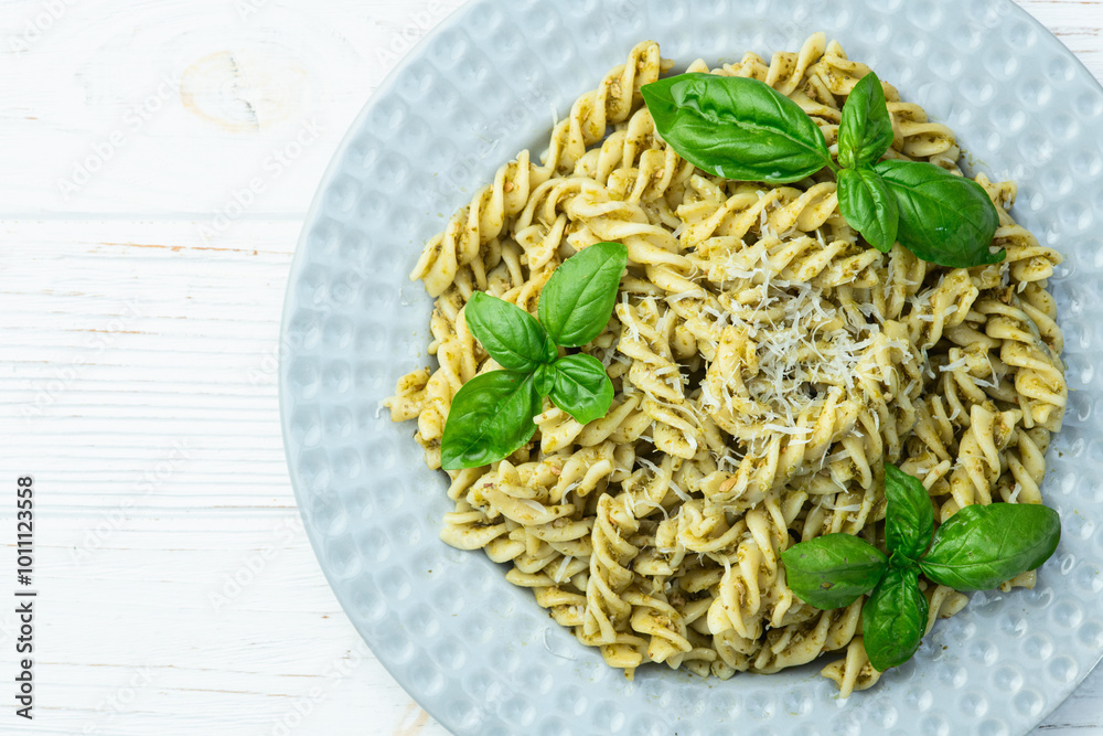 Pasta with basil sauce pesto . Italian food photography . Top view Pasta with basil sauce pesto . Italian food photography . Top view