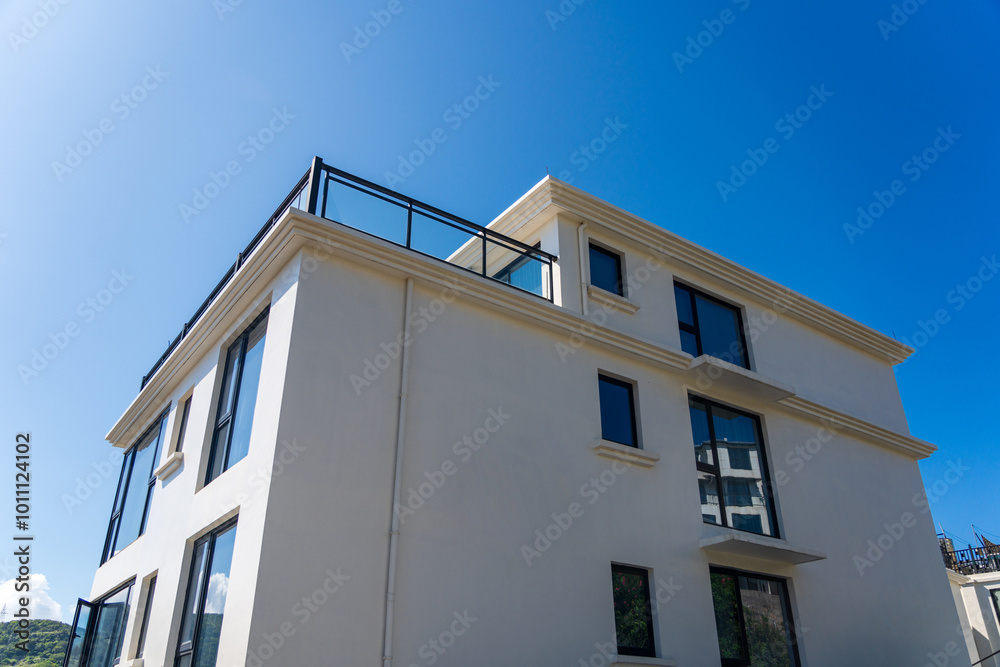 Contemporary Architectural Design Against a Clear Blue Sky Contemporary Architectural Design Against a Clear Blue Sky