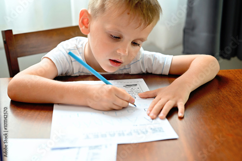 Boy learning to write letters