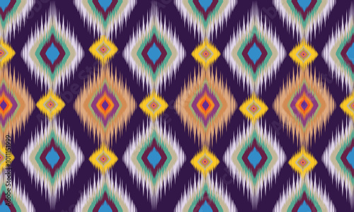 Abstract purple background composed of ethnic fabric patterns Seamless tribal ikat fabric texture