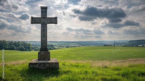 A serene landscape featuring a Celtic cross against a backdrop of rolling hills and a dramatic sky, perfect for reflection or remembrance.