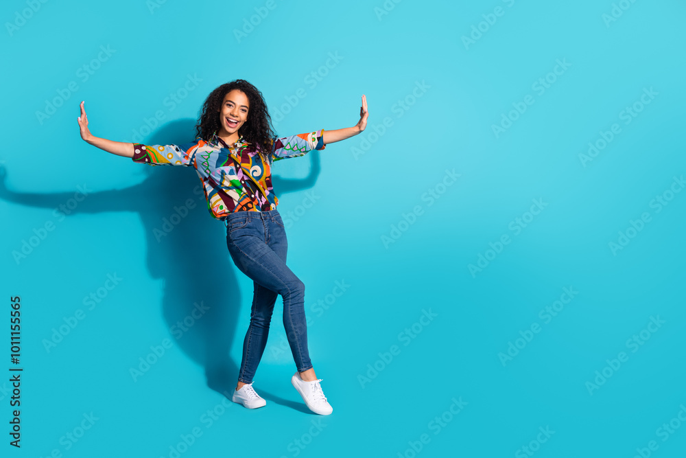 Obraz premium Photo of cheerful lovely cute woman wear trendy clothes hold empty space isolated on blue color background