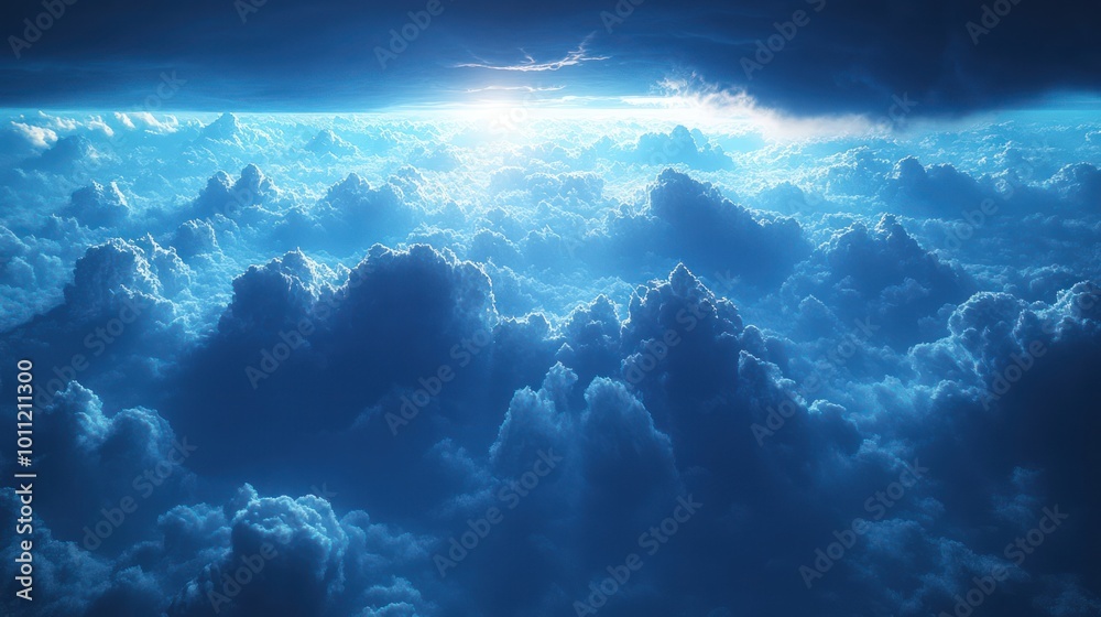 Obraz premium Dramatic aerial view of a sea of clouds with a ray of light breaking through the darkness.
