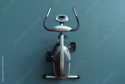 Exercise bike positioned against a blue wall in a fitness area photo