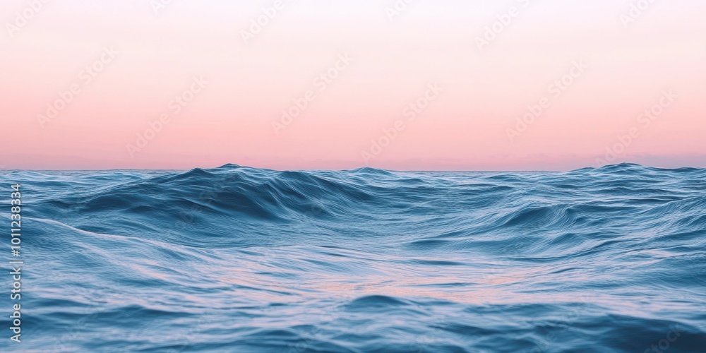 A serene view of ocean waves under a pastel sky at sunset, capturing the tranquility of nature's beauty. A serene view of ocean waves under a pastel sky at sunset, capturing the tranquility of nature's beauty.