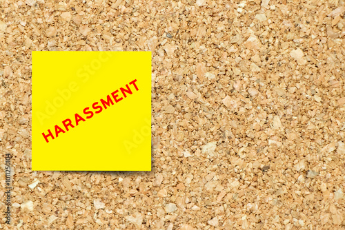 Принти на полотні Yellow note paper with word harassment on cork board background with copy space