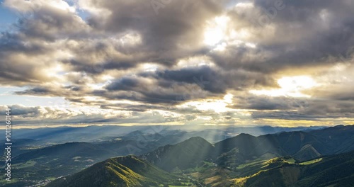 Magic sunset with clouds and golden light of sun motion fast in summer nature Time lapse