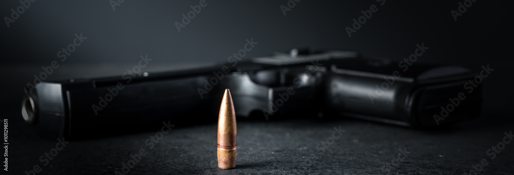 Gun bullet and gun on the table, criminal concept Gun bullet and gun on the table, criminal concept