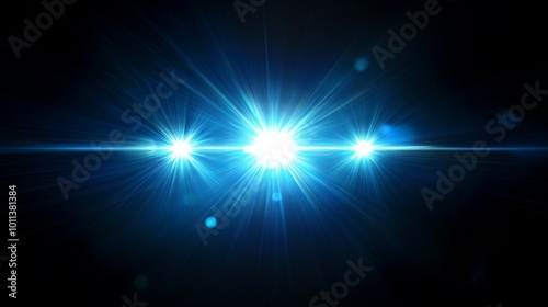Three Bright Blue Lights Create a Stunning Visual Effect Against a Dark Background at Nighttime