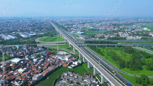 Title	
Established Aerial View of Pasir Koja Interchange, the meeting point of Soroja Toll Road, Purbaleunyi Toll Road and Jakarta-Bandung High Speed ​​Rail Line, Bandung, Indonesia photo