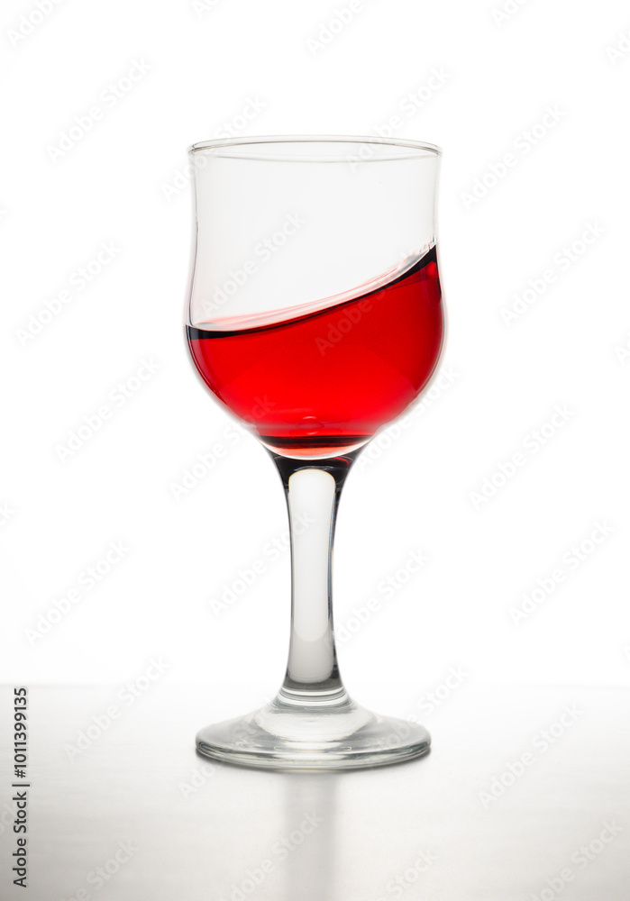 Red wine in glass in front of white background Red wine in glass in front of white background