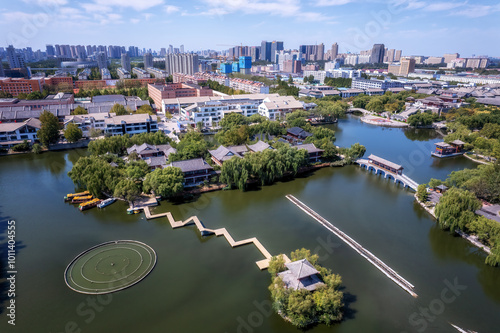 Aerial View of Serene Lakeside Oasis Amidst Urban Cityscape photo