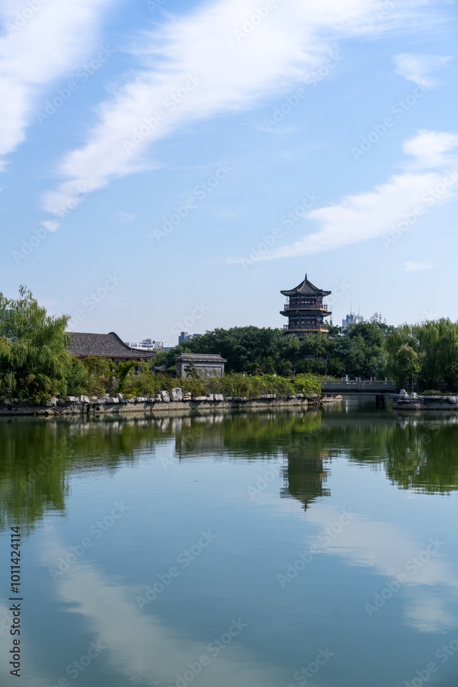 Tranquil Waterfront View with Traditional Architecture and Reflections Tranquil Waterfront View with Traditional Architecture and Reflections