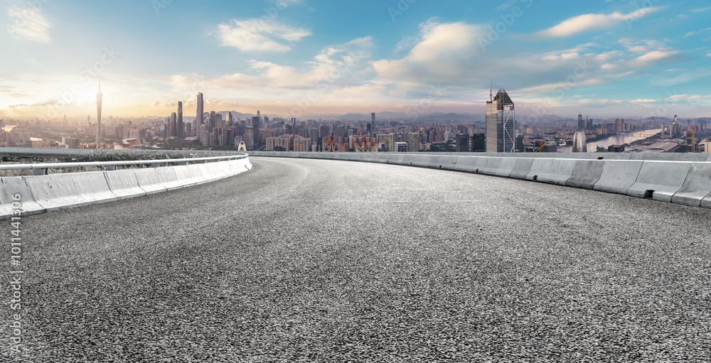 Panoramic View of City Skyline from Curved Urban Road Panoramic View of City Skyline from Curved Urban Road
