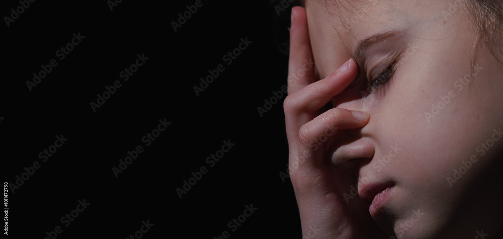 Pain in children. Very sad young girl. Loneliness, pain, child tragedy. Copy space for design. Pain in children. Very sad young girl. Loneliness, pain, child tragedy. Copy space for design.