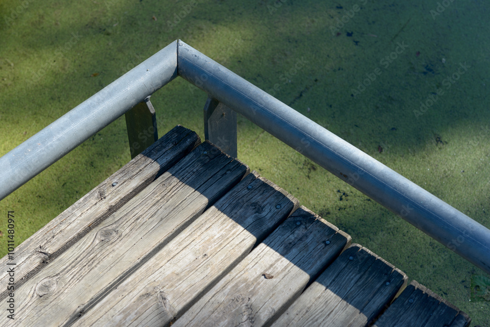 edge of boardwalk and low protective pipe barrier edge of boardwalk and low protective pipe barrier