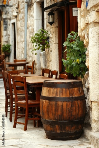 Barrel of wine on a table in an outdoor restaurant in the center of a large European city.